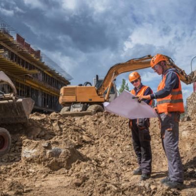 Engineers checking project status at a construction site